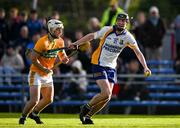 28 October 2024; Alan Mulready of Sixmilebridge is tackled by Oisín Clune of Feakle during the Clare County Senior Club Hurling Championship final match between Sixmilebridge and Feakle at Cusack Park in Clare. Photo by Ray McManus/Sportsfile