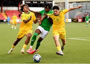 29 October 2024; Jaden Umeh of Republic of Ireland in action against Grant Emerhi, left, and Oskar Pukelis of Lithuania during the UEFA U17 European Championships Round 1 Qualifier match between Republic of Ireland and Lithuania at Inver Park in Larne, Antrim. Photo by Ramsey Cardy/Sportsfile