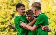 29 October 2024; Brody Lee of Republic of Ireland celebrates with teammates Oisin McDonagh, left, and Michael Noonan after scoring their side's first goal during the UEFA U17 European Championships Round 1 Qualifier match between Republic of Ireland and Lithuania at Inver Park in Larne, Antrim. Photo by Ramsey Cardy/Sportsfile