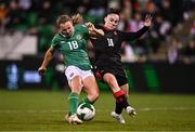 29 October 2024; Kyra Carusa of Republic of Ireland scores her side's second goal despite the efforts of Salome Gasviani of Georgia during the UEFA Women's EURO 2025 Play-Off Round 1 second leg match between Republic of Ireland and Georgia at Tallaght Stadium in Dublin. Photo by Ben McShane/Sportsfile
