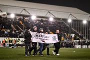 27 October 2024; Family members of late Dundalk supporter 'Maxi' Mark Kavanagh are presented to the crowd at half-time showing their new initiative called &quot;Maxi's Law&quot;, a service to provide unbridled service to sufferers of mental health, at the SSE Airtricity Men's Premier Division match between Dundalk and Shamrock Rovers at Oriel Park in Dundalk, Louth. Photo by Ben McShane/Sportsfile