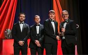 1 November 2024; Cork hurler Eoin Downey is presented with his PwC GAA/GPA All-Star Award by Uachtarán Chumann Lúthchleas Gael Jarlath Burns, right, alongside Gaelic Players Association chief executive Tom Parsons, left, and PwC partner Michael McDaid, second from left, during the 2024 PwC GAA/GPA All-Star Awards at the RDS in Dublin. Photo by Brendan Moran/Sportsfile
