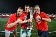 1 November 2024; Shelbourne goalkeepers Conor Kearns, left, Lorcan Healy and goalkeeping coach Paul Skinner celebrate with the SSE Airtricity Men's Premier Division trophy after the SSE Airtricity Men's Premier Division match between Derry City and Shelbourne at The Ryan McBride Brandywell Stadium in Derry. Photo by Stephen McCarthy/Sportsfile
