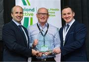 5 November 2024; Karl Dunne, CEO of Ireland Action, left, and John Windle, right, Chairperson Ireland Active, presents Liam Cunningham from Athlone RSC with a special recognition award, during the 2024 National Quality Standard Awards ceremony at the Killashee Hotel in Naas, Kildare. Photo by Matt Browne/Sportsfile