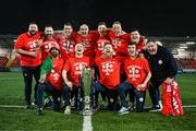 1 November 2024; Shelbourne staff, back row, from left, kitman Karl Watson, team doctor Anthony Hoban, coach David McAllister, assistant manager Joey O'Brien, technical director Luke Byrne, goalkeeping coach Paul Skinner, kitman Graham Watson and kitman Johnny Watson, with, front row, strength and conditioning coach Mauro Martins, physiotherapist Rory Byrne, manager Damien Duff and video analyst Sam Mulhearn celebrate with the SSE Airtricity Men's Premier Division trophy after the SSE Airtricity Men's Premier Division match between Derry City and Shelbourne at The Ryan McBride Brandywell Stadium in Derry. Photo by Stephen McCarthy/Sportsfile