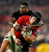2 November 2024; Mike Haley of Munster is tackled by Kini Naholo of All Blacks XV on the way to scoring his side's first try during the match between Munster and All Blacks XV at Thomond Park in Limerick. Photo by Brendan Moran/Sportsfile