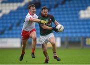 3 November 2024; Jordan Fitzpatrick of Portarlington is tackled by Eoghan Byrne of Tinahely during the AIB Leinster GAA Senior Club Football Championship Round 1 match between Portarlington and Tinahely at Laois Hire O'Moore Park in Portlaoise, Laois. Photo by Tom Beary/Sportsfile