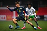 4 November 2024; Euan Glasgow of Scotland in action against Jaden Umeh of Republic of Ireland during the UEFA U17 European Championships Round 1 qualifier match between Scotland and Republic of Ireland at Inver Park in Larne, Antrim. Photo by Ben McShane/Sportsfile