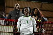 4 November 2024; Jaden Umeh of Republic of Ireland celebrates with his family after the UEFA U17 European Championships Round 1 qualifier match between Scotland and Republic of Ireland at Inver Park in Larne, Antrim. Photo by Ben McShane/Sportsfile