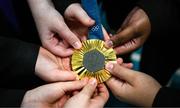 5 November 2024; Pupips from Movilla High School hold the pommel horse gold medal of Rhys McClenaghan during a visit to Movilla High School in Newtownards, Down. As an ambassador with Dare to Believe, the Olympic Schools Programme, Rhys inspires the next generation of school children to believe in themselves and follow their dreams. Photo by Ramsey Cardy/Sportsfile