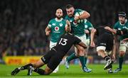 8 November 2024; Rónan Kelleher of Ireland is tackled by Rieko Ioane of New Zealand during the Autumn Nations Series match between Ireland and New Zealand at the Aviva Stadium in Dublin. Photo by Brendan Moran/Sportsfile