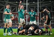 8 November 2024; Ireland players, from left, Garry Ringrose, Joe McCarthy and Caelan Doris celebrate their side's first try scored by team-mate Josh van der Flier, hidden, during the Autumn Nations Series match between Ireland and New Zealand at the Aviva Stadium in Dublin. Photo by Sam Barnes/Sportsfile