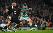 8 November 2024; Hugo Keenan of Ireland in action against Rieko Ioane of New Zealand during the Autumn Nations Series match between Ireland and New Zealand at the Aviva Stadium in Dublin. Photo by Brendan Moran/Sportsfile