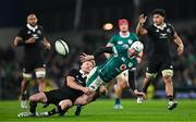 8 November 2024; Mack Hansen of Ireland is tackled by Damian McKenzie of New Zealand during the Autumn Nations Series match between Ireland and New Zealand at the Aviva Stadium in Dublin. Photo by Sam Barnes/Sportsfile