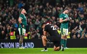 8 November 2024; Ireland players Finlay Bealham, left, and Caelan Doris react at the final whistle of the Autumn Nations Series match between Ireland and New Zealand at the Aviva Stadium in Dublin. Photo by Sam Barnes/Sportsfile