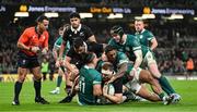 8 November 2024; Sam Cane of New Zealand is tackeld in the in goal area by James Lowe and Bundee Aki of Ireland during the Autumn Nations Series match between Ireland and New Zealand at the Aviva Stadium in Dublin. Photo by Brendan Moran/Sportsfile