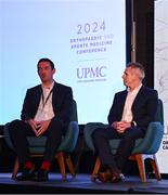 9 November 2024; Dr Ronan Kearney, left, and Dr Ciaran Cosgrave in conversation with MC Ger Gilroy during the UPMC Orthopaedic and Sports Medicine Conference at Croke Park in Dublin. Photo by David Fitzgerald/Sportsfile