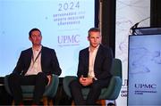 9 November 2024; Dr Ronan Kearney, left, and Dr Ciaran Cosgrave in conversation with MC Ger Gilroy during the UPMC Orthopaedic and Sports Medicine Conference at Croke Park in Dublin. Photo by David Fitzgerald/Sportsfile