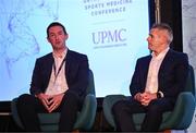 9 November 2024; Dr Ronan Kearney, left, and Dr Ciaran Cosgrave in conversation with MC Ger Gilroy during the UPMC Orthopaedic and Sports Medicine Conference at Croke Park in Dublin. Photo by David Fitzgerald/Sportsfile