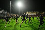 9 November 2024; Kilcoo players warm-up before the AIB Ulster GAA Senior Club Football Championship quarter-final match between Kilcoo and Crosserlough at Páirc Esler in Newry, Down. Photo by Ben McShane/Sportsfile