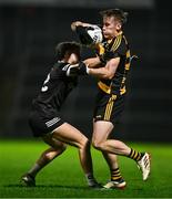 9 November 2024; Brandon Boylan of Crosserlough is tackled by Shealan Johnston of Kilcoo during the AIB Ulster GAA Senior Club Football Championship quarter-final match between Kilcoo and Crosserlough at Páirc Esler in Newry, Down. Photo by Ben McShane/Sportsfile