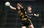 9 November 2024; Brandon Boylan of Crosserlough is tackled by Shealan Johnston of Kilcoo during the AIB Ulster GAA Senior Club Football Championship quarter-final match between Kilcoo and Crosserlough at Páirc Esler in Newry, Down. Photo by Ben McShane/Sportsfile
