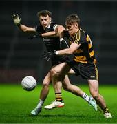 9 November 2024; Brandon Boylan of Crosserlough is tackled by Shealan Johnston of Kilcoo during the AIB Ulster GAA Senior Club Football Championship quarter-final match between Kilcoo and Crosserlough at Páirc Esler in Newry, Down. Photo by Ben McShane/Sportsfile