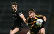 9 November 2024; Brandon Boylan of Crosserlough is tackled by Shealan Johnston of Kilcoo during the AIB Ulster GAA Senior Club Football Championship quarter-final match between Kilcoo and Crosserlough at Páirc Esler in Newry, Down. Photo by Ben McShane/Sportsfile