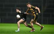 9 November 2024; Shealan Johnston of Kilcoo in action against Cian Boylan of Crosserlough during the AIB Ulster GAA Senior Club Football Championship quarter-final match between Kilcoo and Crosserlough at Páirc Esler in Newry, Down. Photo by Ben McShane/Sportsfile