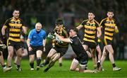 9 November 2024; Fionn Lovett of Crosserlough is tackled by Miceal Rooney of Kilcoo during the AIB Ulster GAA Senior Club Football Championship quarter-final match between Kilcoo and Crosserlough at Páirc Esler in Newry, Down. Photo by Ben McShane/Sportsfile
