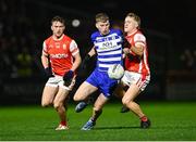 9 November 2024; Dermot Hanafin of Naas in action against Niall O'Callaghan, left, and Eoin O'Callaghan of Cuala during the AIB Leinster GAA Senior Club Football Championship quarter-final match between Naas and Cuala at Cedral St Conleth's Park in Newbridge, Kildare. Photo by Piaras Ó Mídheach/Sportsfile
