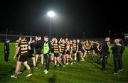 9 November 2024; Crosserlough players and staff after their defeat in the AIB Ulster GAA Senior Club Football Championship quarter-final match between Kilcoo and Crosserlough at Páirc Esler in Newry, Down. Photo by Ben McShane/Sportsfile