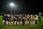 9 November 2024; Crosserlough players and staff huddle after their defeat in the AIB Ulster GAA Senior Club Football Championship quarter-final match between Kilcoo and Crosserlough at Páirc Esler in Newry, Down. Photo by Ben McShane/Sportsfile
