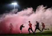 9 November 2024; Cuala supporters run onto the pitch, through flare smoke, after their side's victory in the AIB Leinster GAA Senior Club Football Championship quarter-final match between Naas and Cuala at Cedral St Conleth's Park in Newbridge, Kildare. Photo by Piaras Ó Mídheach/Sportsfile