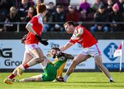 10 November 2024; Conor Cunningham of Corofin in action against Niall Daly, right, and Adam McGreal of Pádraig Pearses during the AIB Connacht GAA Senior Club Football Championship quarter-final match between Corofin and Pádraig Pearses at Tuam Stadium in Tuam, Galway. Photo by Piaras Ó Mídheach/Sportsfile