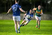 10 November 2024; Robert Leavy of St. Mary's Ardee gets a pass off despite pressure from Liam Jackson of Rathvilly during the AIB Leinster GAA Senior Club Football Championship quarter-final match between St. Mary's Ardee and Rathvilly at DEFY Pairc Mhuire in Ardee, Louth. Photo by Stephen Marken/Sportsfile