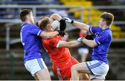 10 November 2024; Rory Stokes of Tinahely in action against Paul McConway and Dan Fox of Tullamore during the AIB Leinster GAA Senior Club Football Championship quarter-final match between Tinahely and Tullamore at Echelon Park in Aughrim, Wicklow. Photo by Matt Browne/Sportsfile