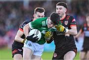 10 November 2024; Conleith McGrogan of Newbridge in action against Sean McCarthy and Adam Kelly ofClann Éireann during the AIB Ulster GAA Senior Club Football Championship quarter-final match between Sean O'Leary GAC Newbridge and Clann Éireann at Celtic Park in Derry. Photo by Oliver McVeigh/Sportsfile