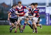 10 November 2024; Ruairi Munnelly of Clontarf in action against Michal Murphy of Terenure during the Bank of Ireland JP Fanagan Premier League 1 match between Terenure and Clontarf at Lakelands Park in Dublin. Photo by David Fitzgerald/Sportsfile