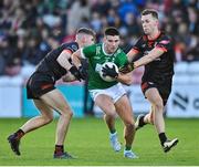 10 November 2024; Conor Doherty of Newbridge in action against Sean McCarthy and Conor McConville of Clann Éireann during the AIB Ulster GAA Senior Club Football Championship quarter-final match between Sean O'Leary GAC Newbridge and Clann Éireann at Celtic Park in Derry. Photo by Oliver McVeigh/Sportsfile