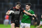 10 November 2024; Barry McCambridge of Clann Éireann in action against Callum McGrogan of Newbridge during the AIB Ulster GAA Senior Club Football Championship quarter-final match between Sean O'Leary GAC Newbridge and Clann Éireann at Celtic Park in Derry. Photo by Oliver McVeigh/Sportsfile