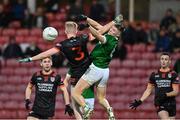 10 November 2024; Michael O’Shea of Clann Éireann in action against Patrick McMullan of Newbridge during the AIB Ulster GAA Senior Club Football Championship quarter-final match between Sean O'Leary GAC Newbridge and Clann Éireann at Celtic Park in Derry. Photo by Oliver McVeigh/Sportsfile