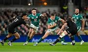 8 November 2024; Garry Ringrose of Ireland, supported by Hugo Keenan, left, and Jamison Gibson-Park, in action against Rieko Ioane, left, and Jordie Barrett of New Zealand  during the Autumn Nations Series match between Ireland and New Zealand at the Aviva Stadium in Dublin. Photo by Sam Barnes/Sportsfile