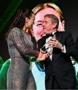 9 November 2024; The Paris 2024 Medallists were the winners of the PTSB Inspiring a Nation Award 2024 which was presented by Eamonn Crowley, CEO of PTSB, title sponsors to Team Ireland. Pictured is Boxing gold medallist Kellie Harrington being presemted with her award by PTSB CEO Eamonn Crowley.
