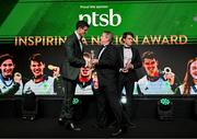 9 November 2024; The Paris 2024 Medallists were the winners of the PTSB Inspiring a Nation Award 2024 which was presented by Eamonn Crowley, CEO of PTSB, title sponsors to Team Ireland. Pictured is Rowing bronze medallist Philip Doyle being presented with his award by PTSB CEO Eamonn Crowley.