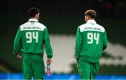 14 November 2024; Tom Cannon, left, and Kasey McAteer of Republic of Ireland wearing a tracksuit in tribute to the 1994 World Cup Republic of Ireland team before the UEFA Nations League B Group 2 match between Republic of Ireland and Finland at the Aviva Stadium in Dublin. Photo by Michael P Ryan/Sportsfile