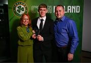 14 November 2024; Michael Noonan with the Men's Under-16 International Player of the Year award, alongside his parents Sandie and Andrew during the 34th FAI International Awards at the Aviva Stadium. Photo by Ben McShane/Sportsfile