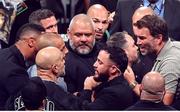 15 November 2024; Promoter Eddie Hearn, right, exchanges words with Jordan Maldonado, manager of Amanda Serrano and MVP promotions co-founder Nakisa Bidarian after the undisputed super lightweight championship fight between Katie Taylor and Amanda Serrano at AT&T Stadium in Arlington, Texas, USA. Photo by Stephen McCarthy/Sportsfile