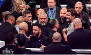 15 November 2024; Promoter Eddie Hearn, right, exchanges words with Jordan Maldonado, manager of Amanda Serrano, left, after the undisputed super lightweight championship fight between Katie Taylor and Amanda Serrano at AT&T Stadium in Arlington, Texas, USA. Photo by Stephen McCarthy/Sportsfile