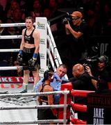 15 November 2024; Katie Taylor looks on as Amanda Serrano receives medical attention during their undisputed super lightweight championship fight at AT&T Stadium in Arlington, Texas, USA. Photo by Stephen McCarthy/Sportsfile